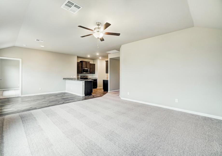 The home's entertainment space stretches from the family room to the kithcen.