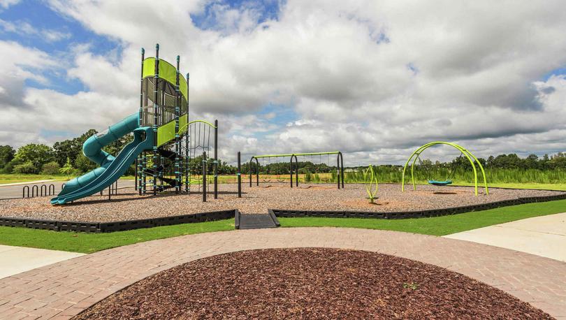 Playground in the community of Autumn Lakes with a handicap accessible ramp to enter the play area.