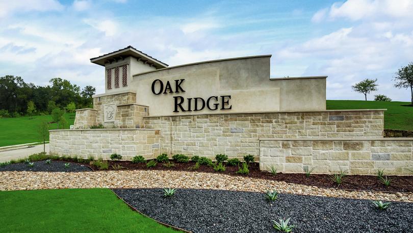Oak Ridge new home community welcome sign at the front of the neighborhood