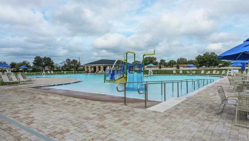 A children's water slide set in the shallow end of the pool n the Poinciana community.
