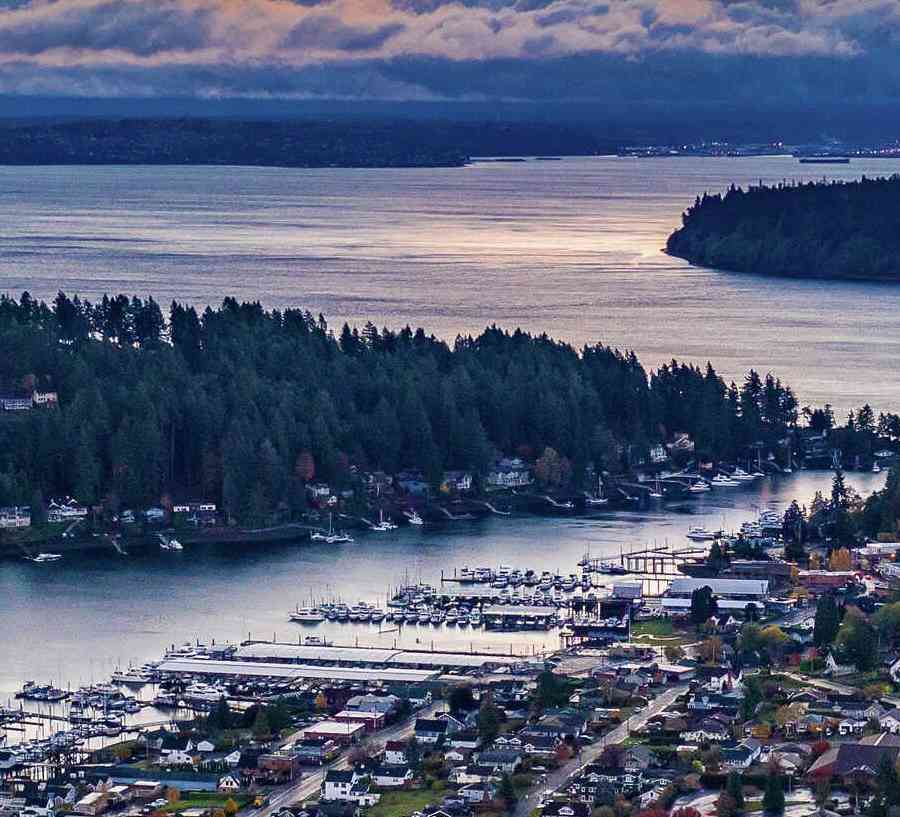 Tacoma, Washington Gig Harbor at sunrise showing water inlets, town, and forest area