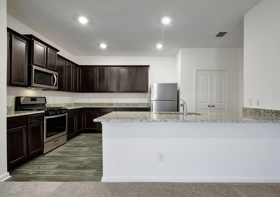 Chef-ready kitchen filled with upgrades, like granite countertops and stainless appliances.