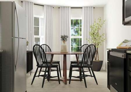 Rendering of
  dining area with light wood look flooring, bay windows and cream walls.
  Kitchen is visible in the foreground.