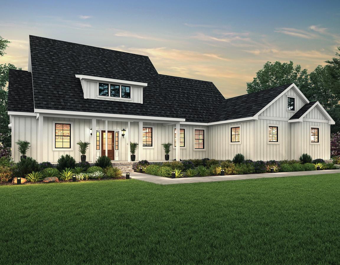 Dusk elevation of the single-story Yonah with white siding and a sideload garage.