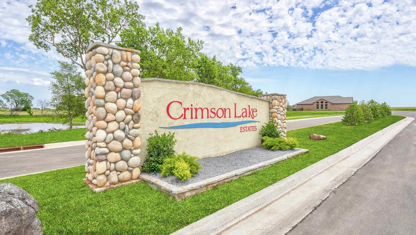 Crimson Lake Estates new home community sign that welcomes visitors to the neighborhood