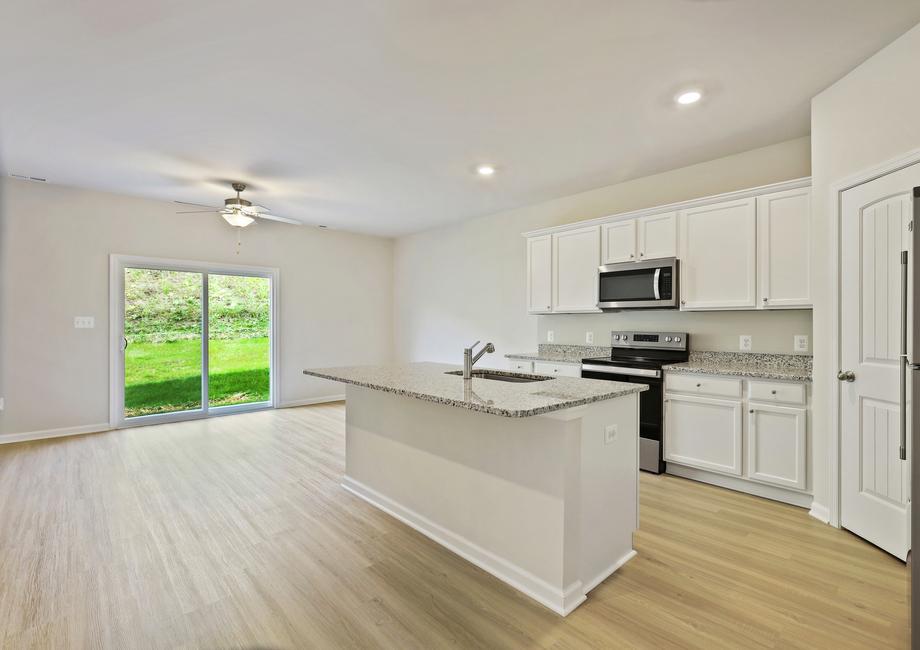 Kitchen with white cabinets and stainless appliances.