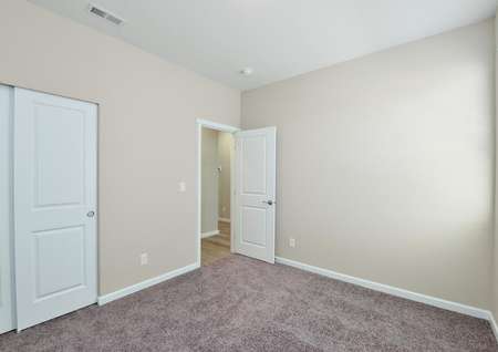 Secondary bedroom with carpet