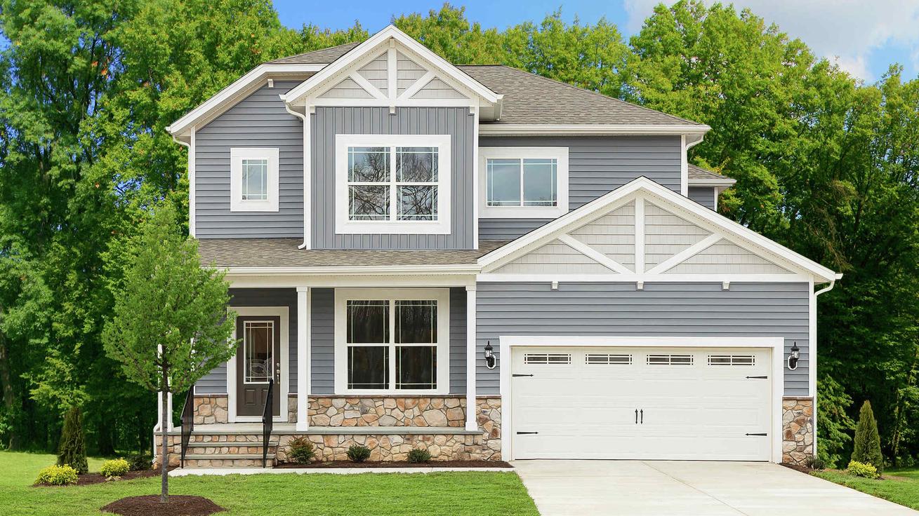 The Mid Atlantic Newport view of two story home with two car garage and covered porch.
