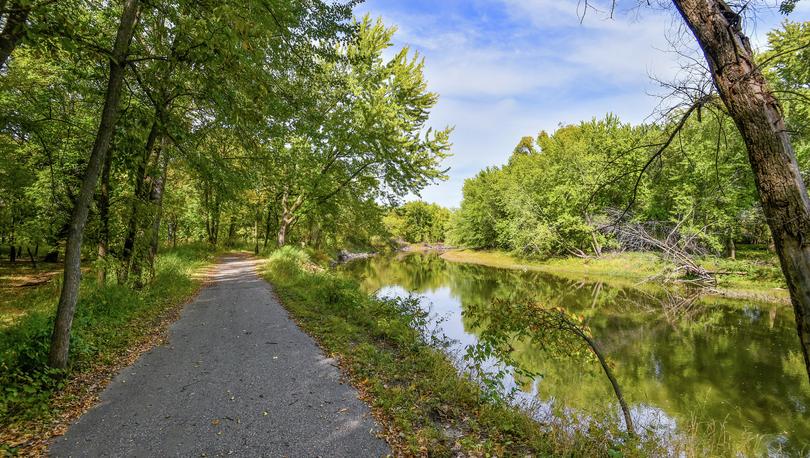 Photo of the paved walking trail that runs along the Crow River near Riverpointe Park in Watertown, MN.