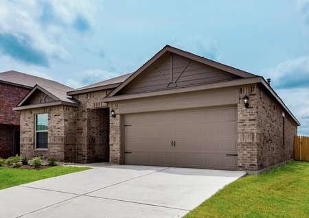 The Reed has a great curb appeal with a brick and siding exterior, attached garage and covered front entryway.