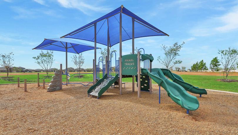 Children's playground with shading above equipment in the Freeman Ranch community