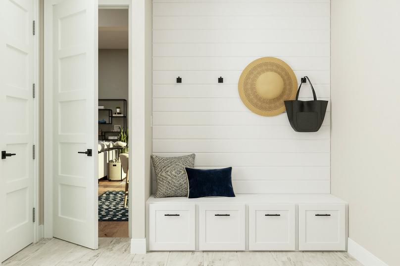 Rendering of the laundry room showing a
  white bench with storage sitting below hanging hooks and a view to the living
  space.