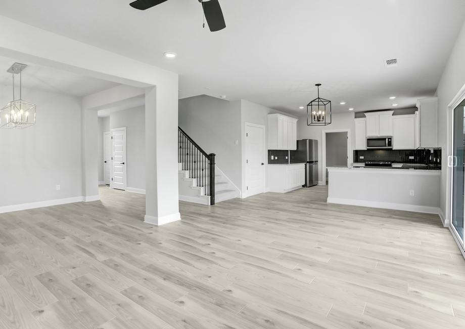 Open-concept layout with the dining room opening up to the living room, and the kitchen overlooks the family room.