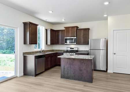 Kitchen with granite countertops and stainless steel appliances