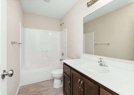 Photo of the second full bathroom in the Blackberry townhome by LGI Homes.