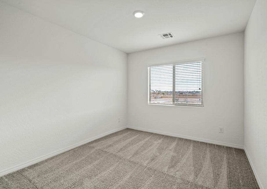 Secondary bedroom with carpet