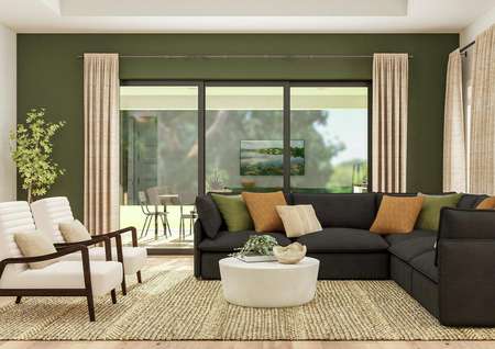Rendering of the inviting living room
  featuring a large grey sectional sofa, two low armchairs and coffee table
  sitting on a rug. In the background a green accent wall is enhanced by
  impressive sliding glass doors that open to the outdoor kitchen.