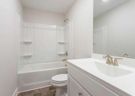 Hartford guest bath with modern fixtures, bath/shower combo, and white cabinets
