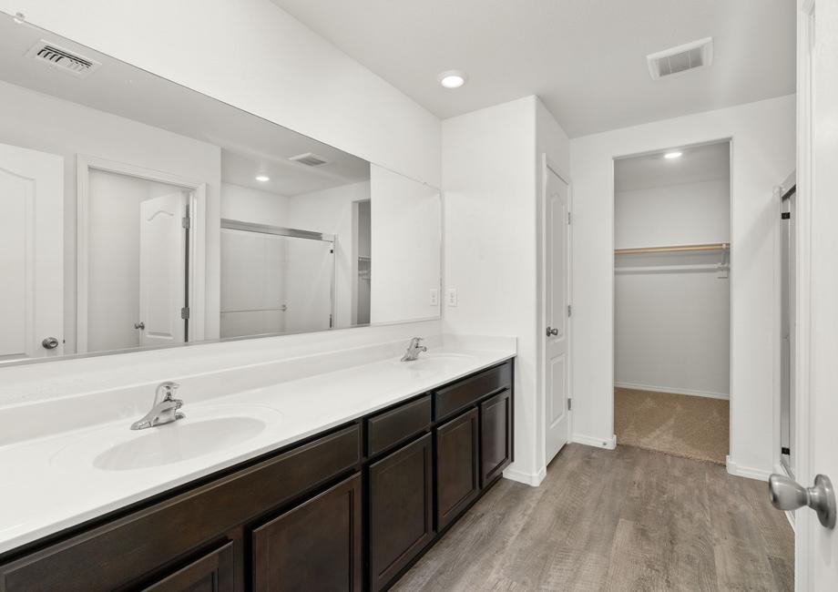 Master bathroom with a walk-in shower and closet.