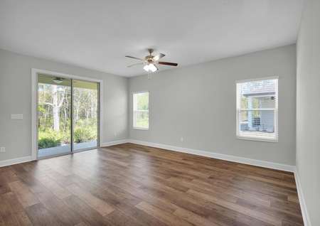 The family room is spacious and has a sliding glass door to the back yard