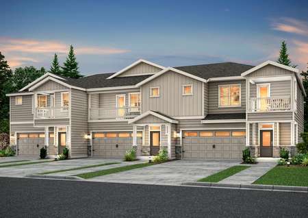 Artist rendering of a townhome building with 3 homes, in light gray siding and with stone accents, at dusk from the right angle.