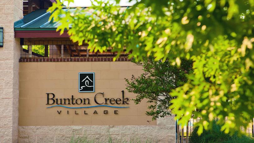 Bunton Creek new home community welcome sign at the entrance of the neighborhood