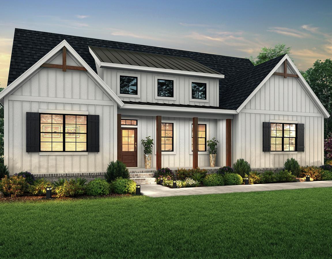 Dusk elevation of the single story Unicoi with white siding, dark shutters and wood accents.