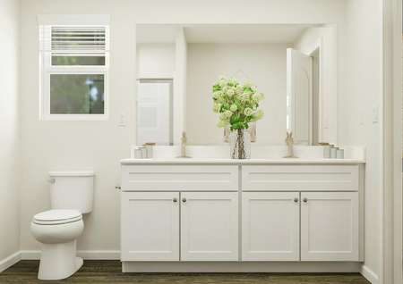 Rendering of the master bath focused on
  the double-sink vanity. The vanity has white cabinetry and vinyl wood plank
  flooring. Above the toilet is a window.