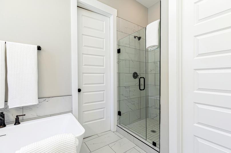 Master bathroom with standalone tub and walk-in shower.