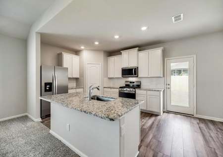 The kitchen comes with beautiful, white cabinetry and granite countertops.