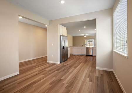 The dining room is open to the kitchen and foyer.