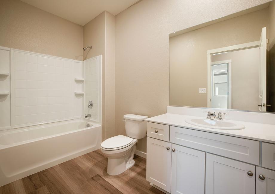 The secondary bath has a gorgeous vanity.