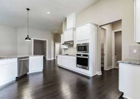 Spacious kitchen with stainless steel appliances and a walk-in pantry. 
