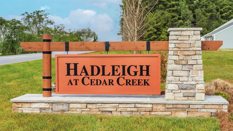 Hadleigh at Cedar Creek stone and wood monument.