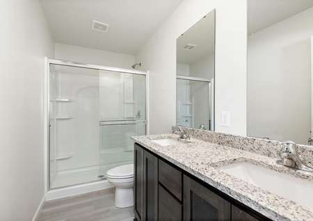 The master bathroom is spacious and ready for you to get ready in the morning