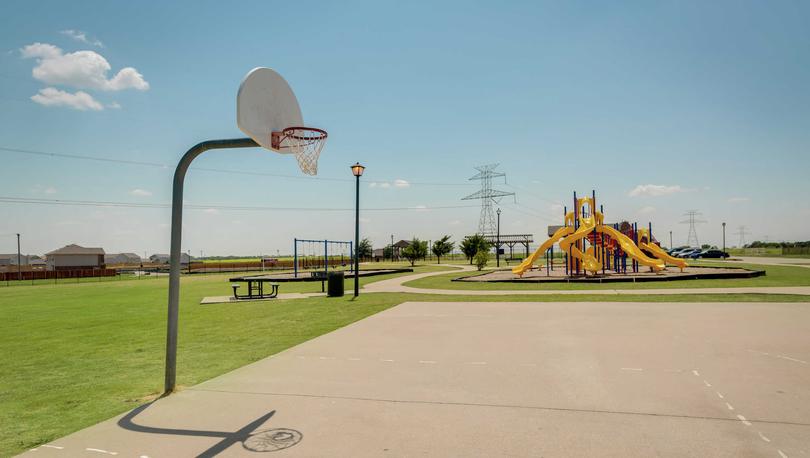 Patriot Estates new home community basketball courts and kid's play area