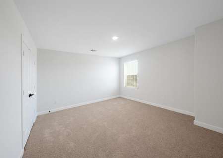 Secondary bedroom with carpet