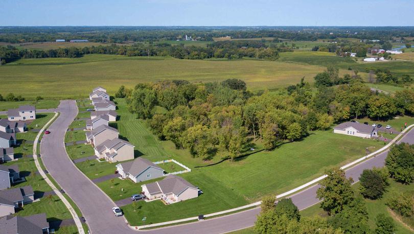White Trail Ridge new home community overhead drone shot showing row of new houses
