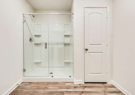 The master bath has a stunning glass enclosed shower.