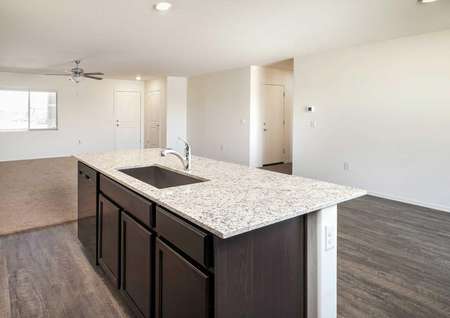 The Luna floorplan shows a kitchen with a granite bar and a view into the living room.