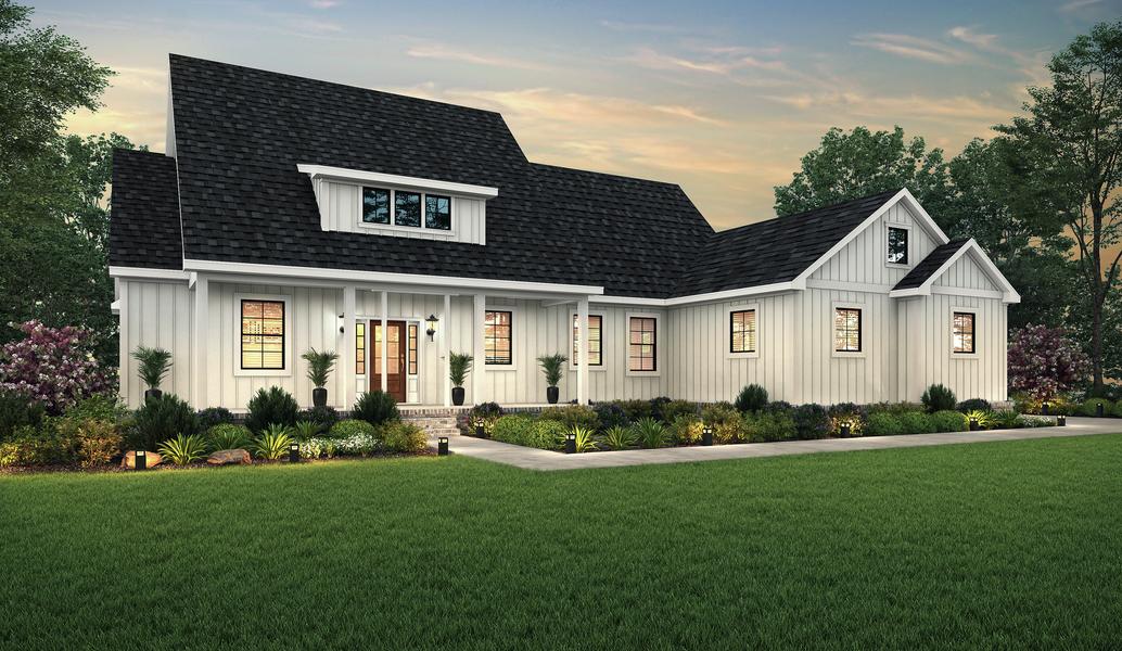 Dusk elevation of the single-story Yonah with white siding and a sideload garage.