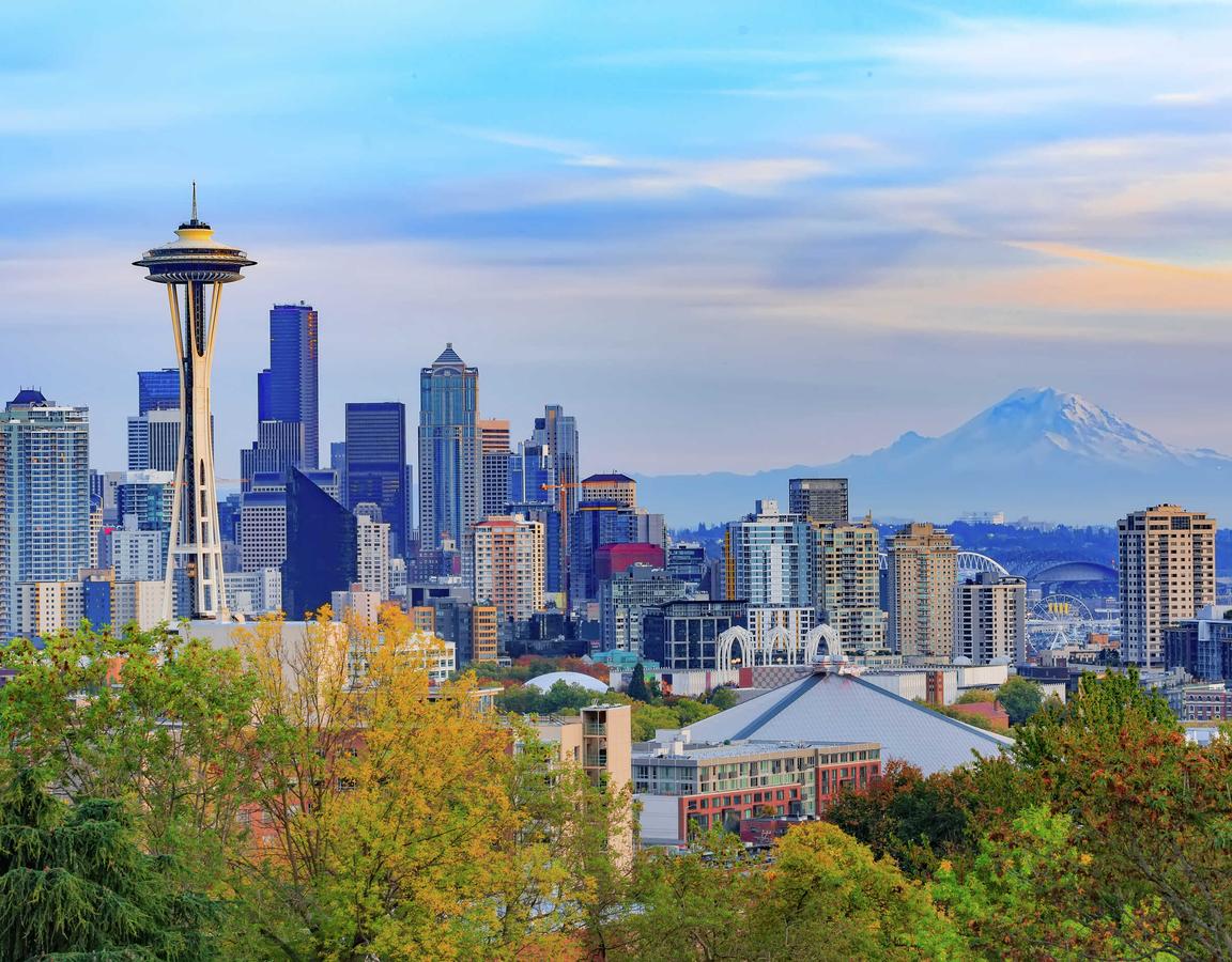 Panorama view of Seattle downtown skyline and Mt. Rainier, Washington.