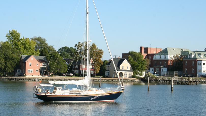 A sailboat leaving harbor in Hampton, Virginia.
