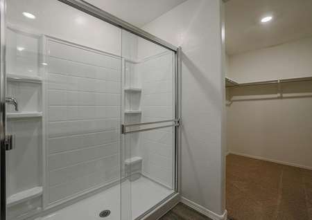 Stunning master shower with sliding doors in the attached master bathroom.
