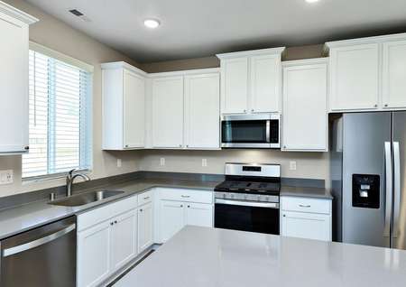 Kitchen with white cabinets and stainless steel appliances