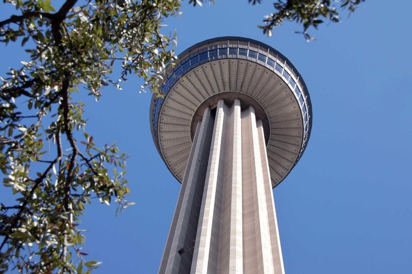 San Antonio, Texas Tower of the Americas and revolving restaurant taken from the ground looking up showing disk-shaped structure on a pillar