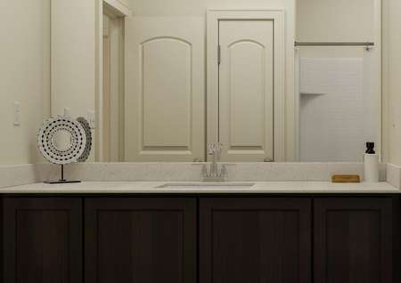 Rendering of the
  secondary bathroom featuring an oversized vanity.