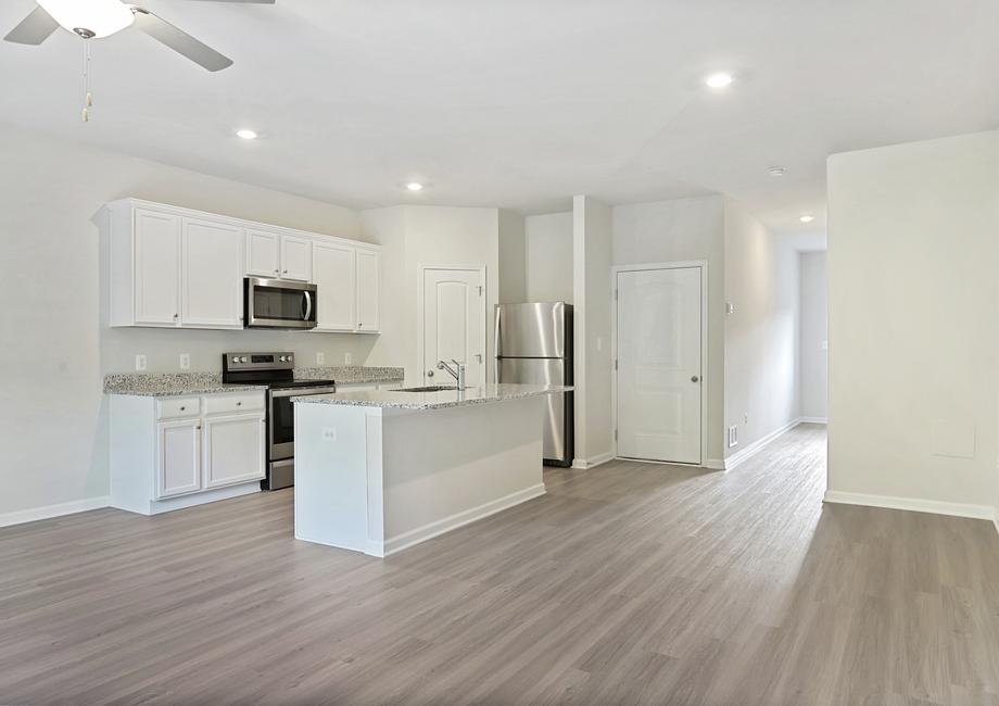 Angled shot of the kitchen with stainless appliances.