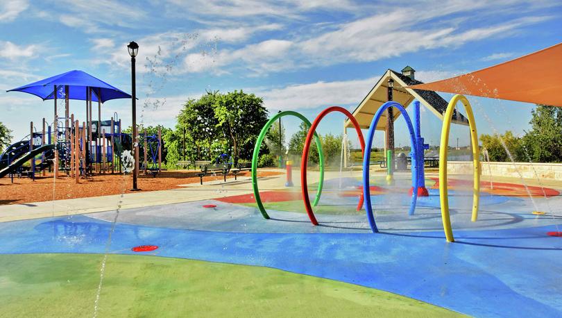 Luckey Ranch new home community children's playground with splash pad for hot summer days