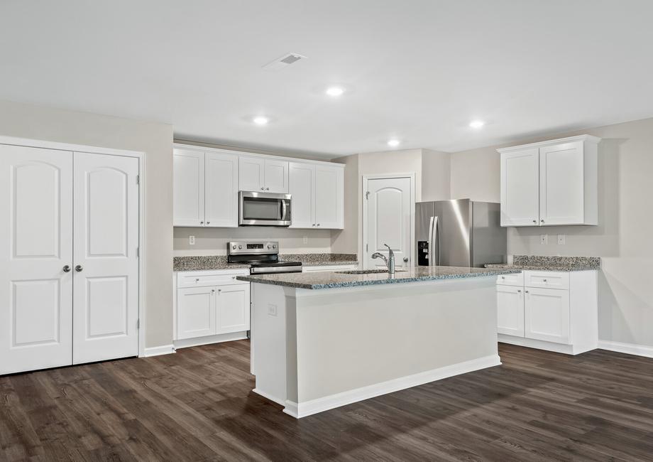 The chef ready kitchen has stainless steel appliances and granite countertops.